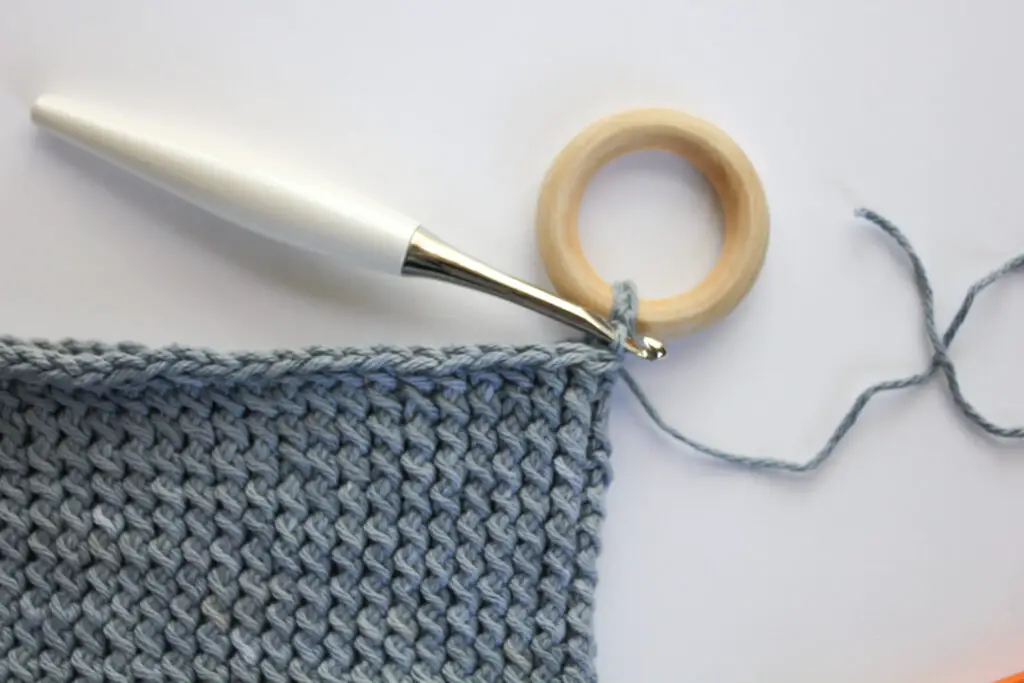 Crochet around the wooden ring.
