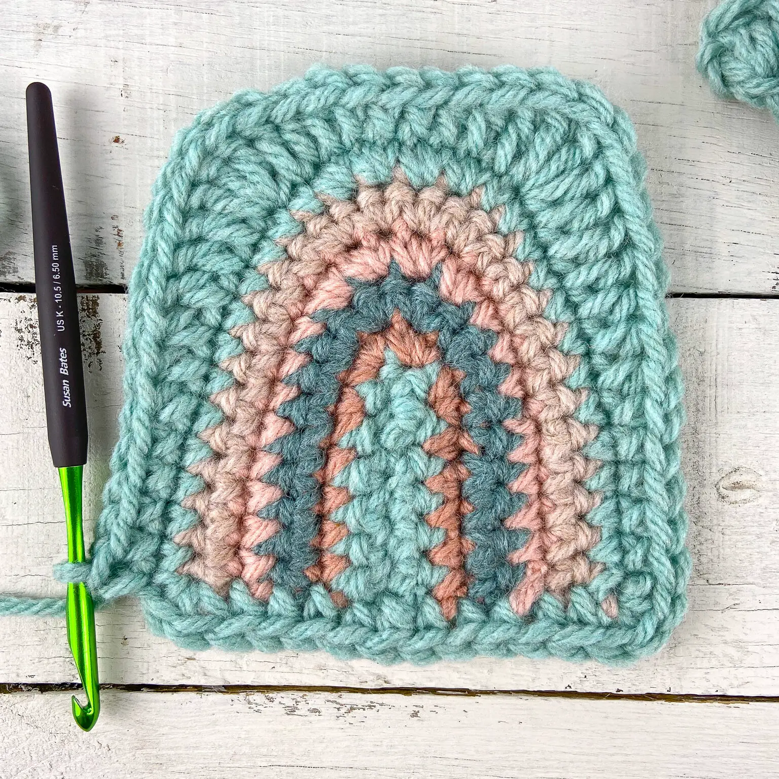 Round 7 of the rainbow squares crochet baby blanket