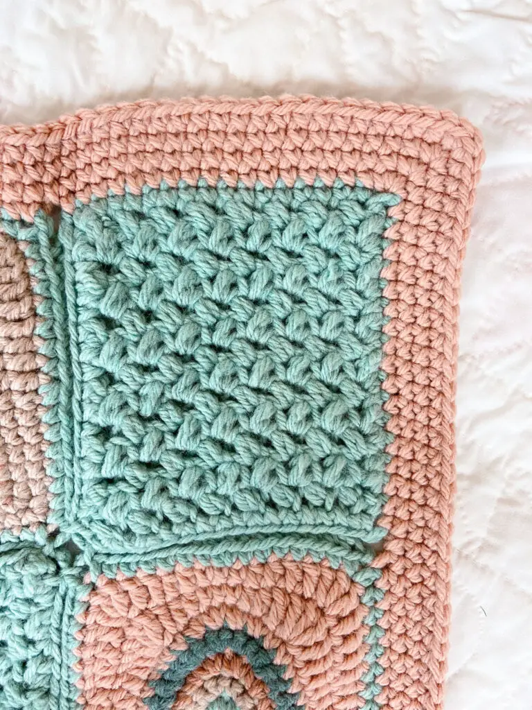 the single crochet border of the rainbow crochet baby blanket