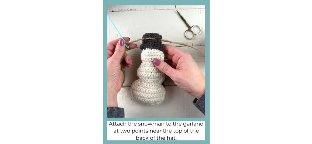  Stringing the crochet snowman to make a garland.